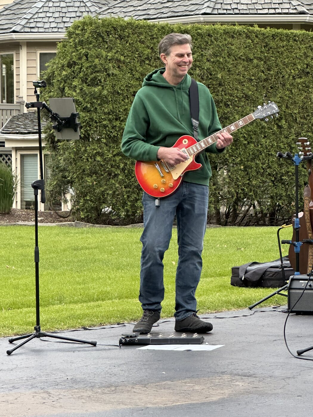 Dave Herda playing guitar in his dad band